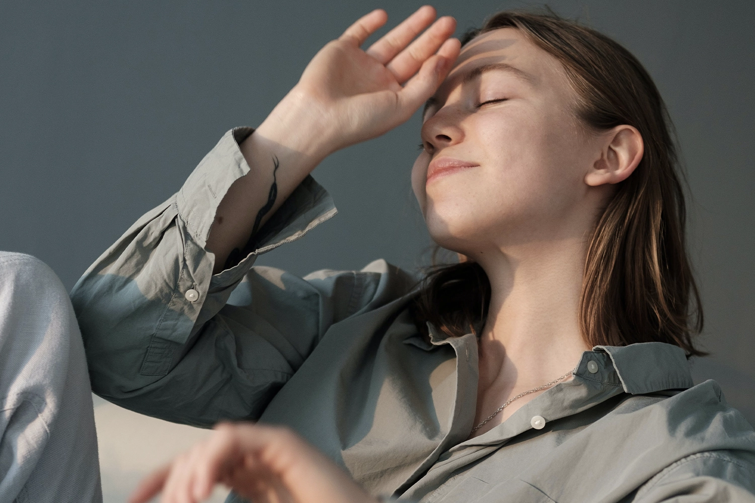 lady sitting in sun with eyes closed